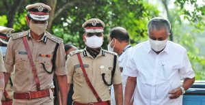 Chief Minister Pinarayi Vijayan being escorted by police officials in Thiruvananthapuram. (South First)