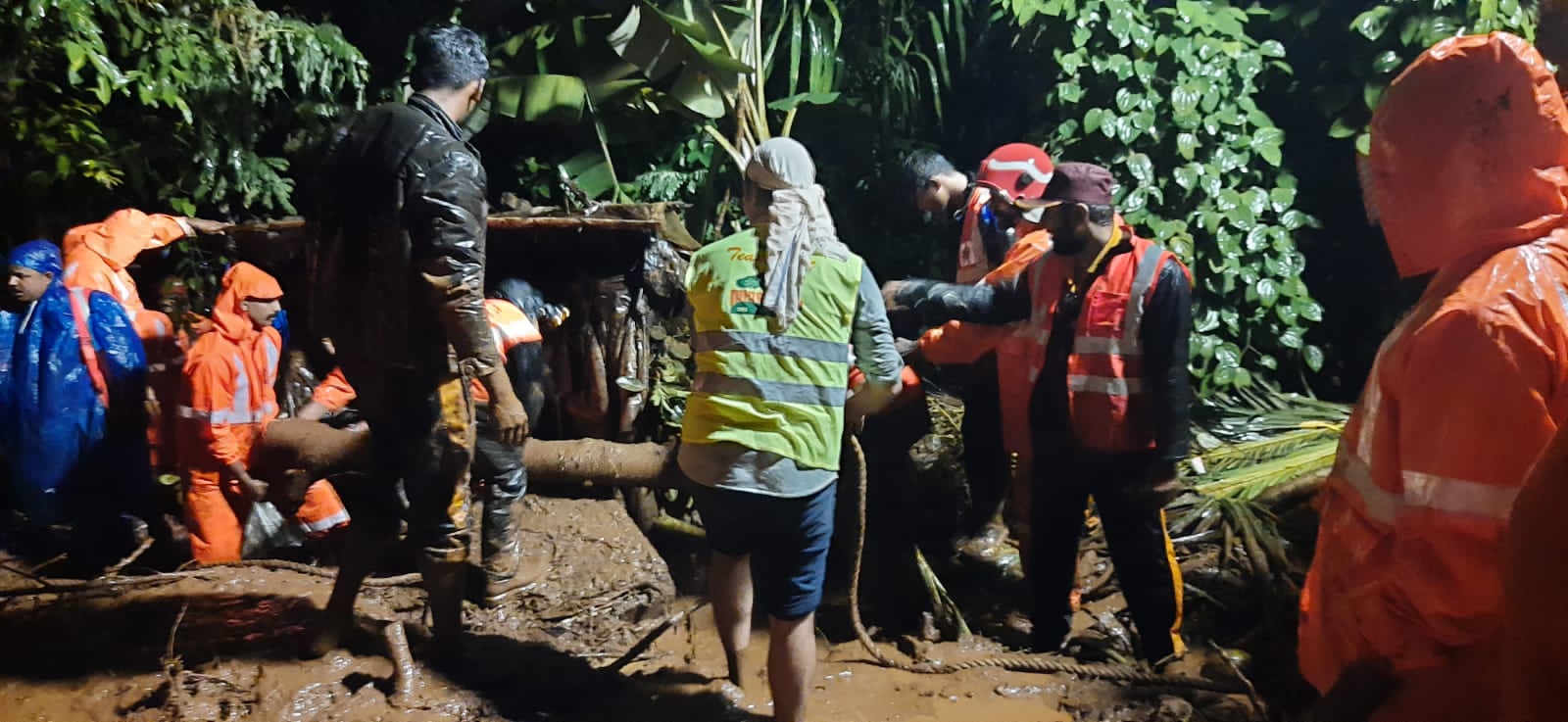 Rescue workers removing landslide rubbles of a house in Kerala's Kannur district.