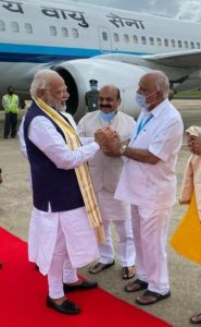 Chief Minister Basavaraj Bommai receives Prime Minister Narendra Modi at Bengaluru with BS Yediyurappa. File Photo