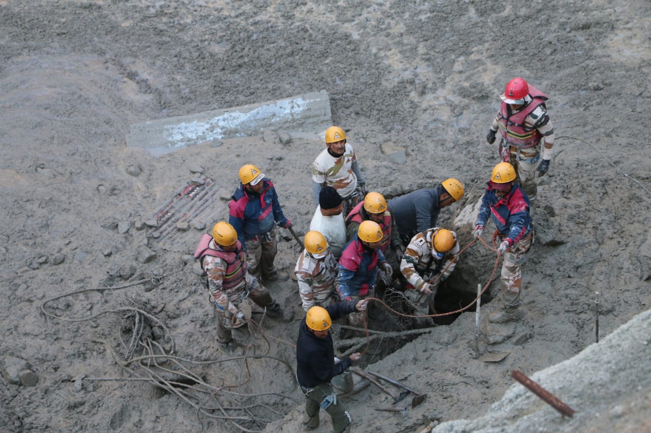 Rescue team pull out bodies of two minor girls holding to each other from landslide rubble in Karnataka's Dakshina Kannada.