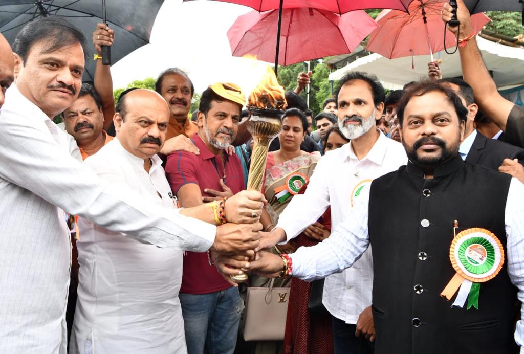 Bommai seen with Minister Munirathna, JD(S) leader Saravana and actors Shivarajkumar and Raghavendra Rajkumar at the inauguration of the Lalbagh Botanical Garden’s Independence Day flower show themed after Dr Rajkumar and his late son Puneeth Rajkumar on Friday, 5 August. (Supplied)