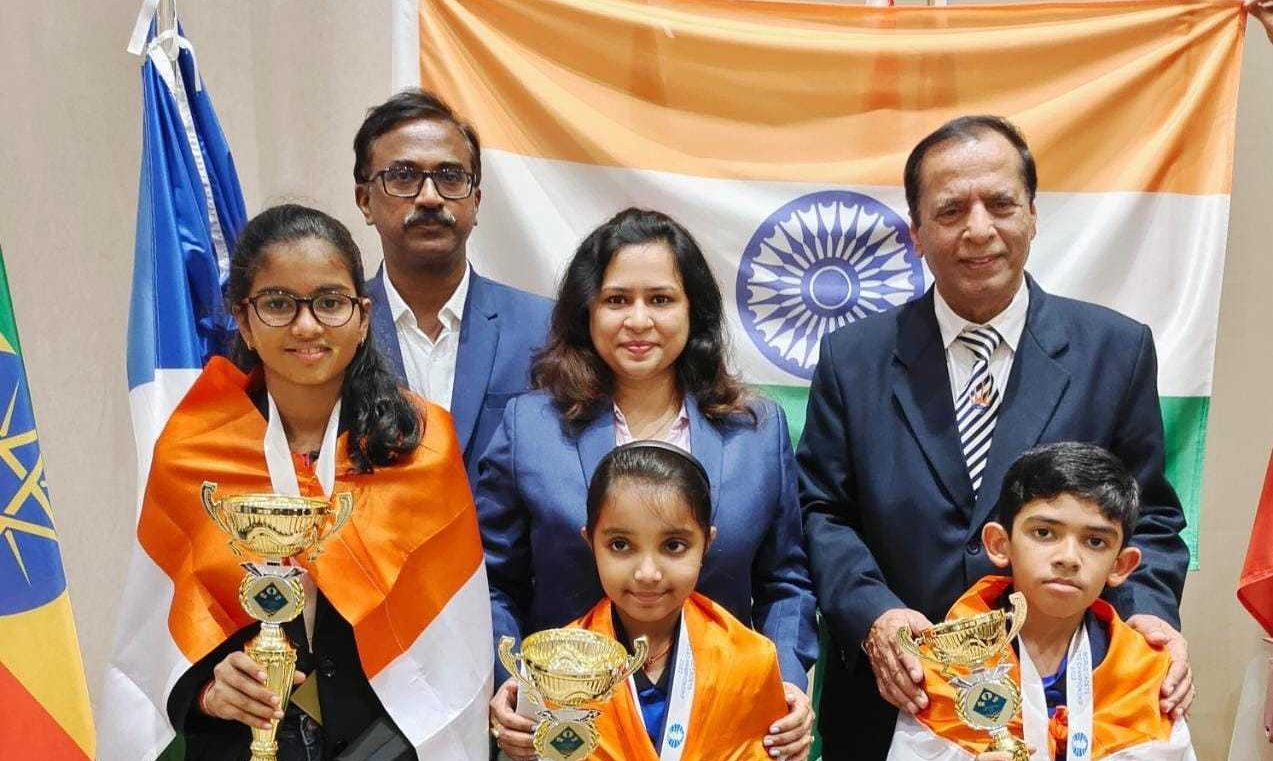 (From left to right) India's Shubhi Gupta, Charvi Anilkumar and Safin Shafiullakhan with their trophies at the World Cadets Chess Championship. (Supplied)
