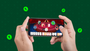 Person playing online rummy in a mobile