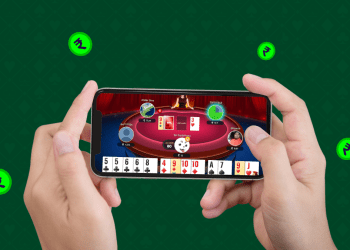 Person playing online rummy in a mobile