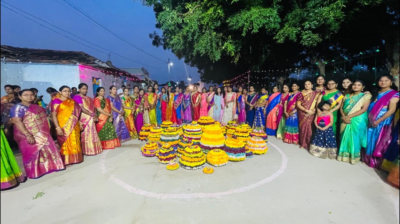 Women line up with Bathukammas in Shanigaram, Siddipet district, in 2021 (Supplied)