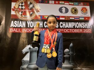Charvi Anilkumar with the Asian Youth Chess Championship trophy.