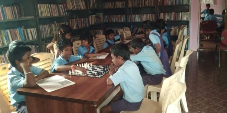 Karnataka rural libraries, children reading books and playing chess