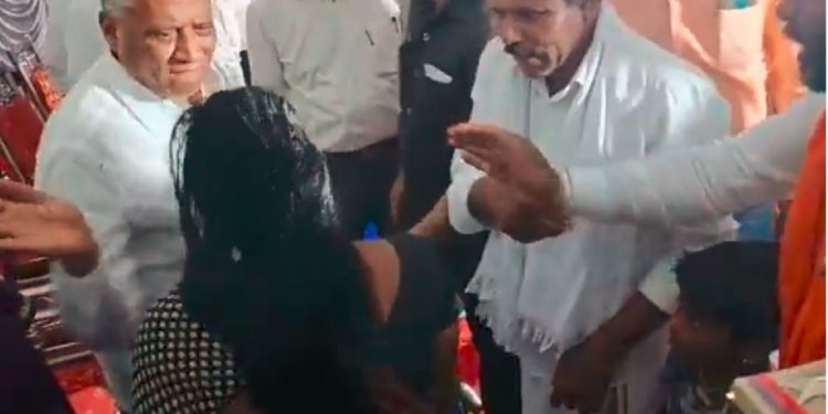 Video grab of minister V Somanna slapping a woman on dias in Chamrajnagar