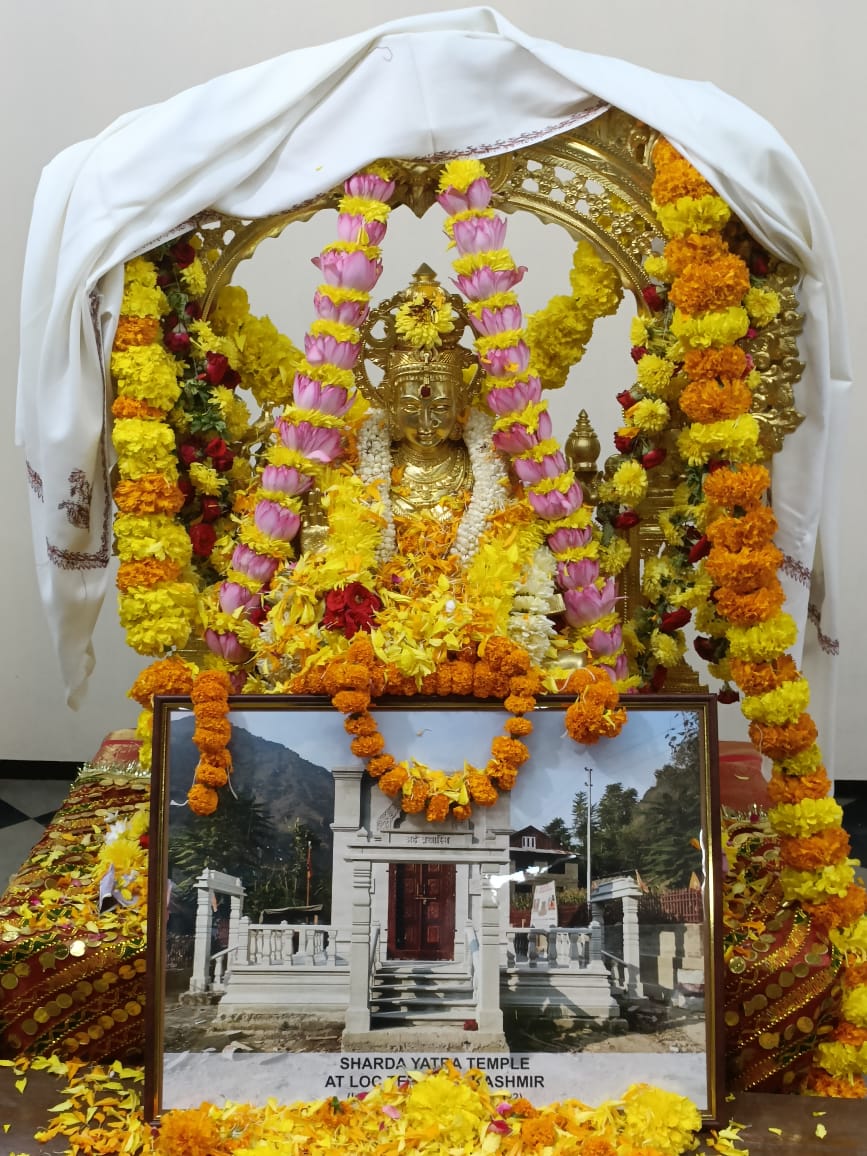 The Sharda mata panchaloha idol and the photograph of the newly built temple in Teetwal in Kashmir