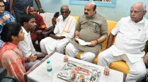 Karnataka Chief Minister Basavaraj Bommai and BJP veteran BS Yediyurappa at a Dalit family's house in the Vijayapura district on 12 October, 2022. (Supplied)