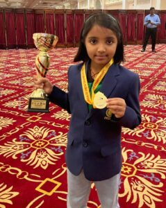 Charvi Anilkumar with the trophy and medal of 2022 Commonwealth Youth Chess Championships held in Sri Lanka