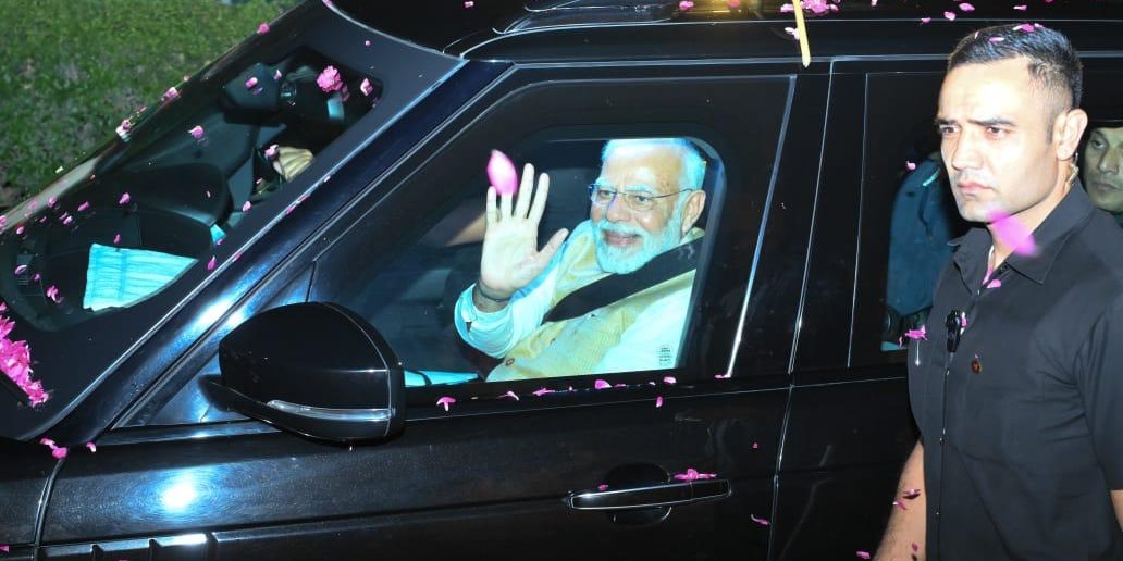 Prime Minister Narendra Modi waves at the public at a roadshow in Visakhapatnam on Friday, 11 November, 2022. (Supplied)