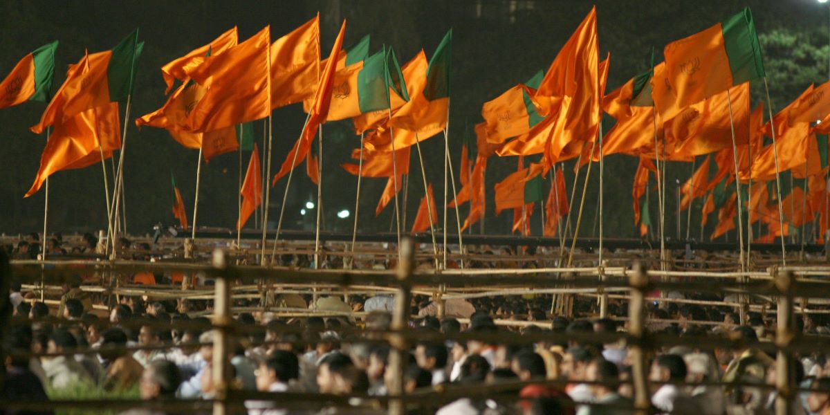 Raised BJP flags during an election rally. (Creative Commons)