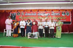 HRF Bulletin-2022 being released at the ninth Andhra Pradesh and Telangana state conference. Aakar Patel, K Jeevan Kumar, Usha Seethalakshmi, A Chandrashekar, UG Srinivas, G Madhava Rao, and S Tirupatayya can be seen