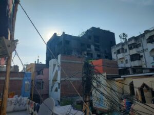 A view of the gutted Deccan Corporations buildling from the Kachi Bowli colony