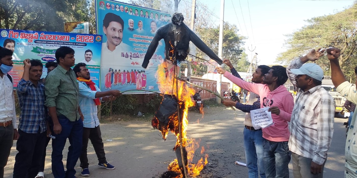 Andhra Pradesh tribals and activists burn an effigy marked "Adani" in protest against PSPs on their land. (Supplied)
