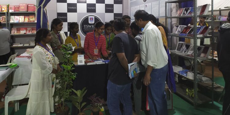 Young authors from the Telangana Social Welfare Residential Degree College interact with interested readers at the Hyderabad Book Fair. (Arkadev Ghoshal/South First)