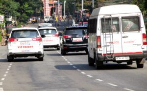 A convoy of security vehicles surrounds the car of Vijayan. Photo: K B Jayachandran.