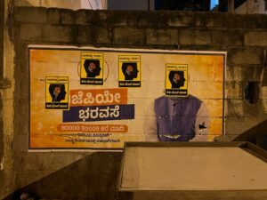 Posters of #Kivimelehoova stuck on BJP's achievement stickers overnight in Bengaluru