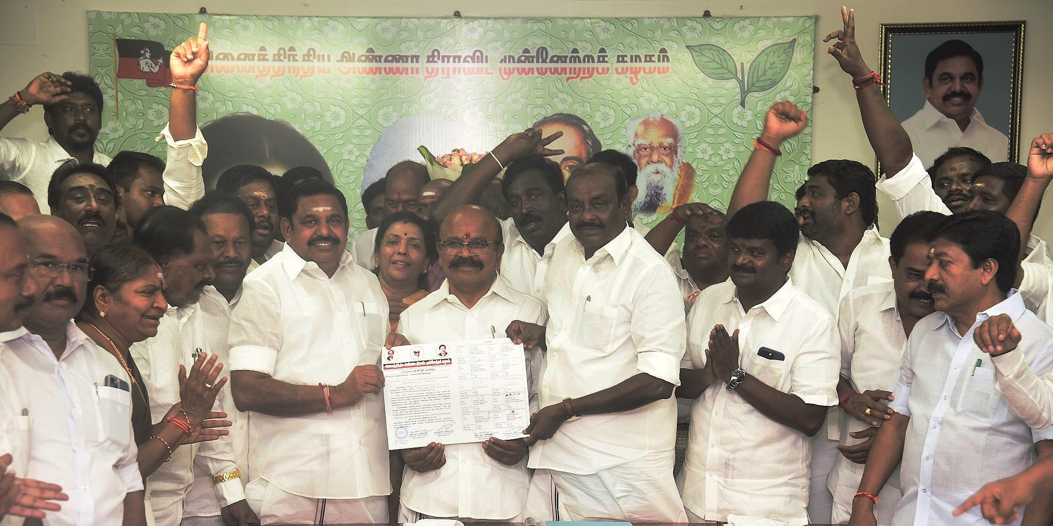 AIADMK election commissioners Pollachi V Jayaraman and Natham R Viswanathan hand over the winner's certificate in the general secretary elections to E Palaniswami in Chennai on Tuesday, 28 March. (Supplied)