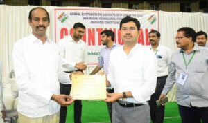 North Andhra graduates' constituency winner, TDP candidate Vepada Chiranjeevi receiving his certificate from Visakhapatnam collector Mallikarjuna Rao. (Supplied)