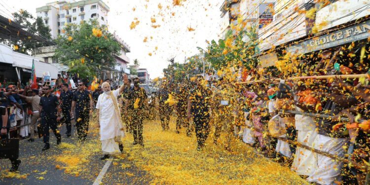 Prime Minister Narendra Modi is received by people of Kochi during a road show on Monday, 24 April, 2023. (Supplied)