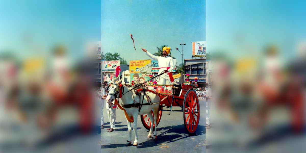 Rajkumar riding in a horse cart during the shooting of 'Akasmika'