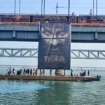 A closer look of the poster launch of Tiger Nageswara Rao on the Havelock Bridge in Rajahmundry