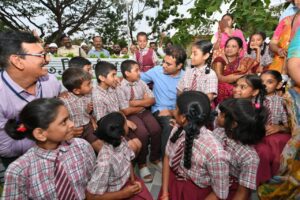 Telangana Minister KTR with Lashkar Bazar Government School students in Hanumakonda, Warangal.