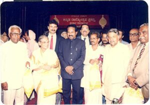 At the Karnataka Rajyotsava award ceremony in 1993 (RNJ is standing behind Veerappa Moily, the then CM)