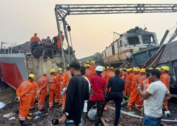 Rescue personnel work at the site of the derailed trains in Odisha on Saturday, 3 June, 2023.