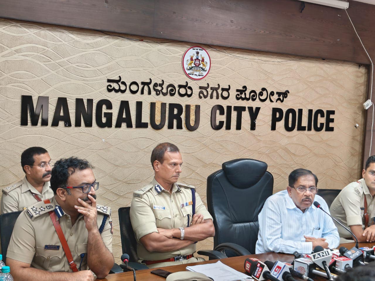 Home Minister Dr G Parameshwara with police officials in Mangaluru