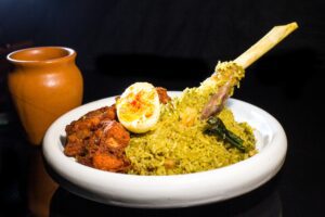 At Raahi, mutton donne biryani is served with chicken kebabs and a boiled egg inspired by the regional style.