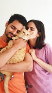 Rahil Alankrita with their cat, Courage.