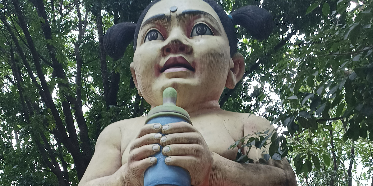 Statue of child with milk bottle at Ranadheera Kanteerava park. (Supplied)