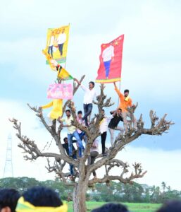 Creating 20 lakh jobs will rejuvenate the state's economy, feels N Lokesh. Youngsters perch on a tree to have a better view of the TDP scion. (Supplied)