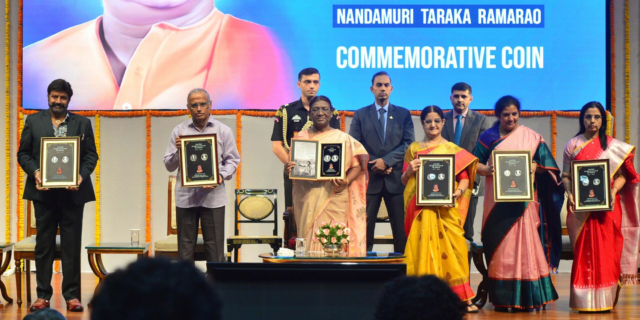 President Droupadi Murmu and members of NTR's family release the ₹100 commemorative coin on Monday, 28 August, 2023. (Supplied)