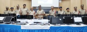 The Cyberabad police officials with the seized items in the three fake call centres case