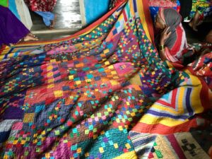 These quilts, meticulously woven by married women, serve the purpose of providing warmth during the winter and comfort in the cool rainy season. 