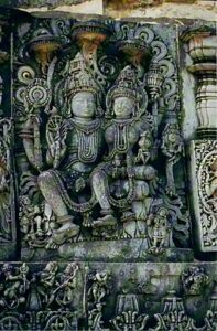 A sculpture of Vishnu with Lakshmi at Halebidu (Wikipedia)