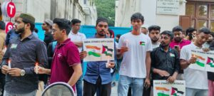Placard holding members at the solidarity event in Bengaluru