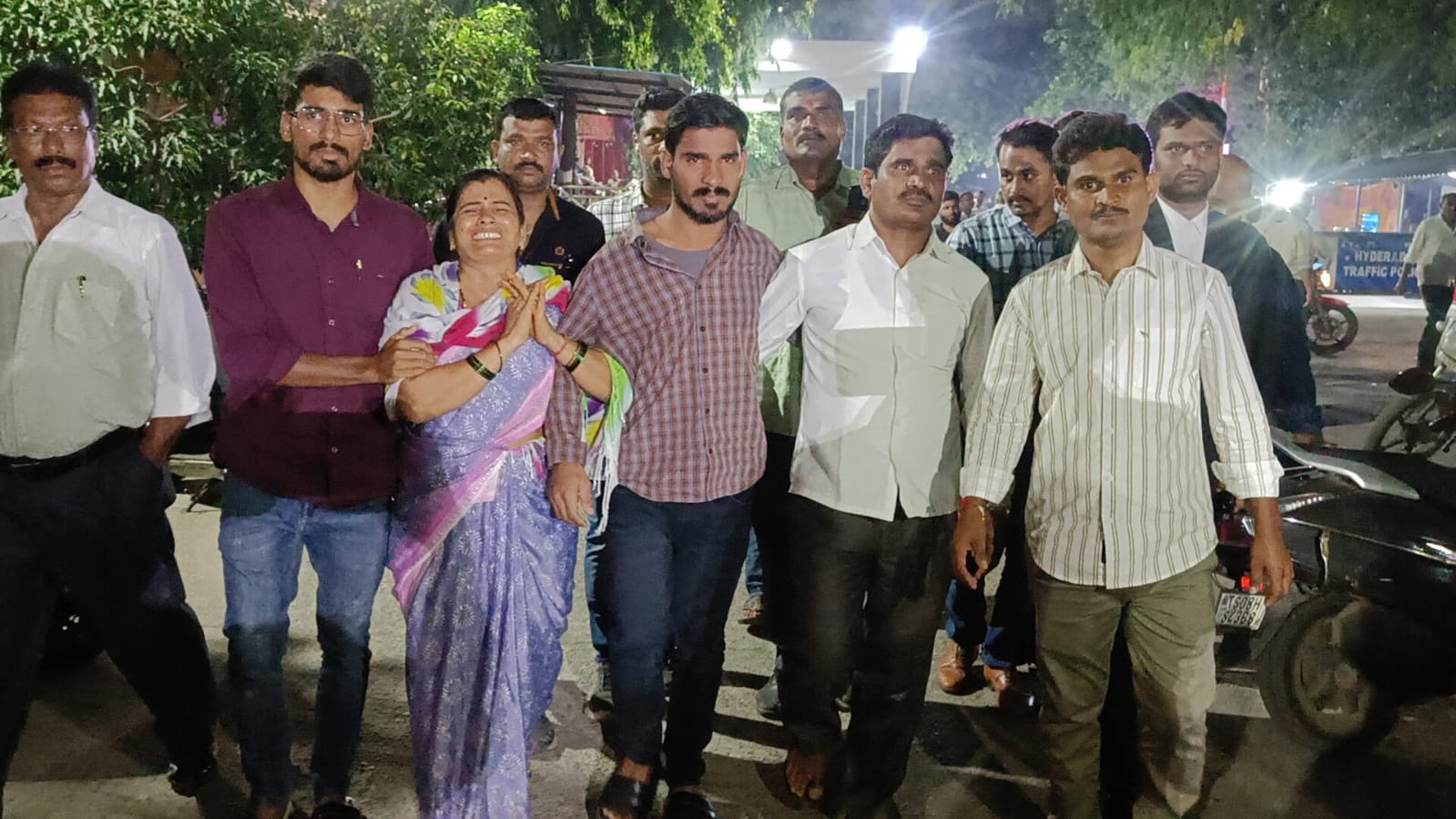 The accused, Shivaram Rathod, with his mother and others at the court on Friday. (Supplied)