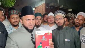 Representatives of Muslim community displaying the Class 4 textbook
