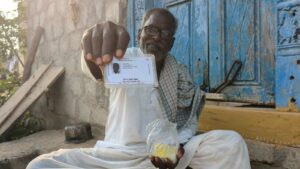 Pendela Sattaiah, a resident of Chintamadaka, sharing his age as per Aadhar card.