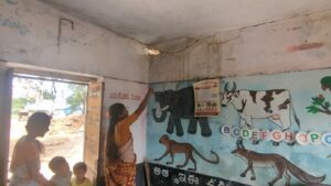 Anganwadi staff pointing at the dilapidated state of the centre in Eranpally village. (South First) 