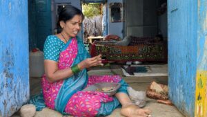 A women rolling the beedi at Dubbak. 