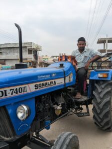 Anil on his tractor in Munugode. Deepika Pasham/ South First