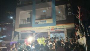 Crowd watching Sirisha while she was attending a media interview in between the campaign. (Bhaskar Basava/South First)