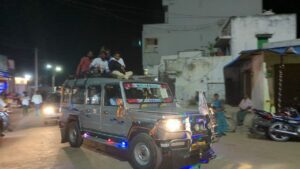 A youth on the campaign vehicle of Sirisha in Kollapur (Bhaskar Basava/South First)