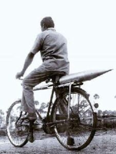 A rocket part is being transported to Thumba using a bicycle in the 1960s. Photo: Supplied